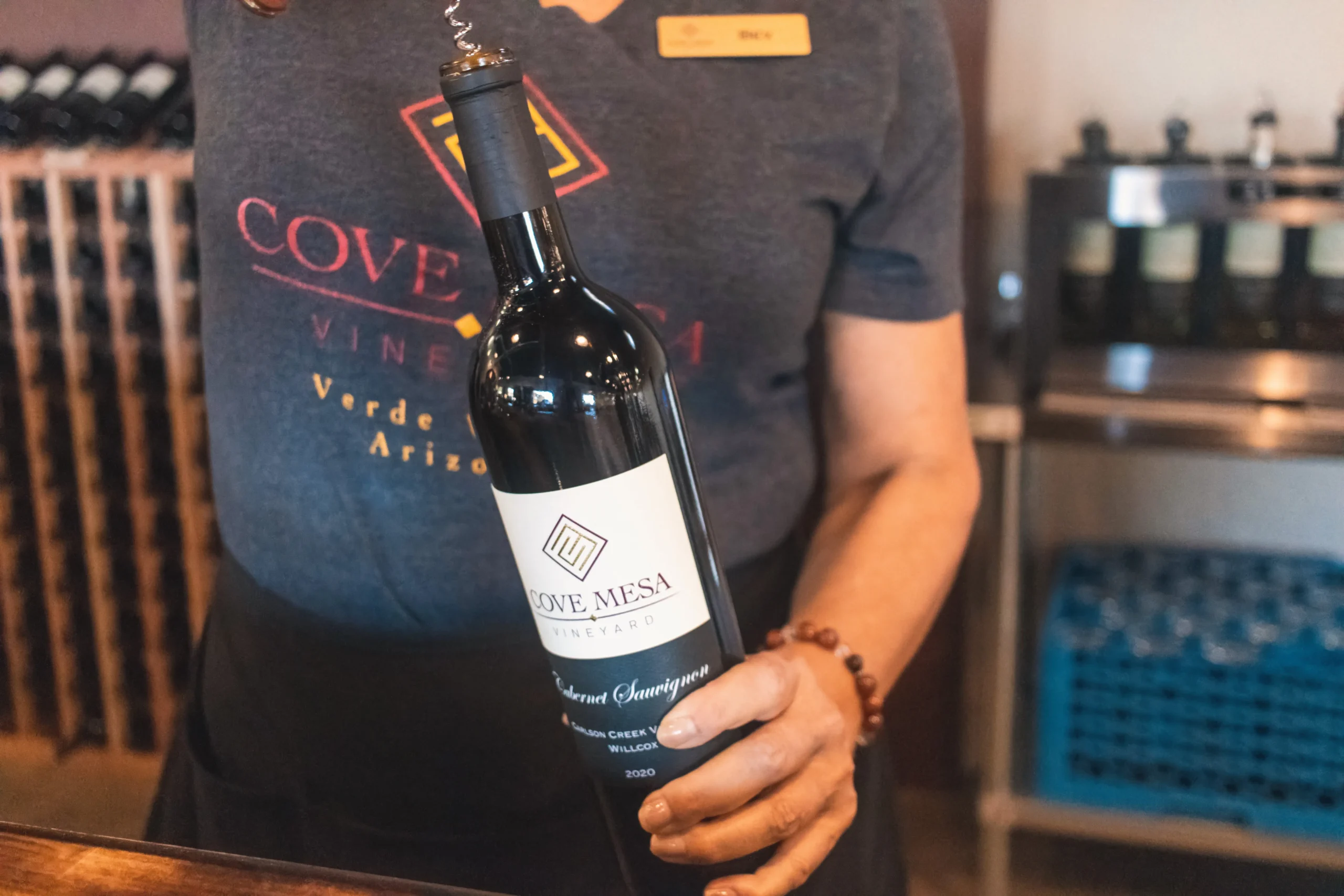 Cove Mesa wine bottle being opened